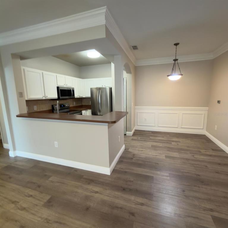 12861 Madison Pointe Circle, Unit 101 Orlando, FL 32821 - Photo 9 of 30 a view of a kitchen with electric appliances