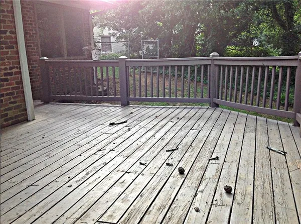 a view of balcony with wooden floor