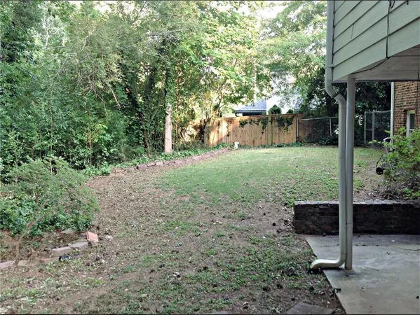 a view of backyard with green space