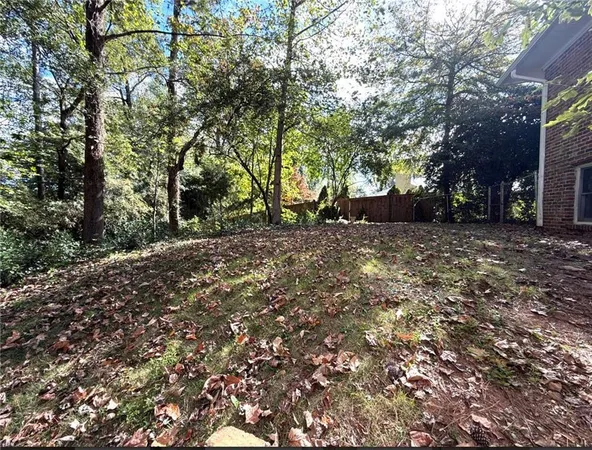 a backyard of a house with lots of green space