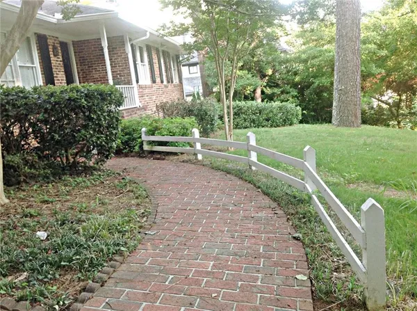 a view of a garden with a fountain