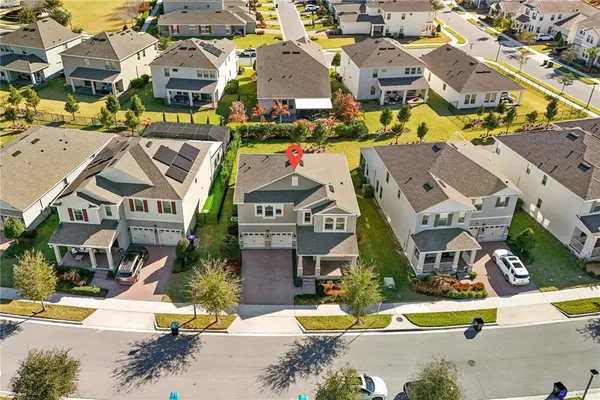 an aerial view of residential houses with outdoor space