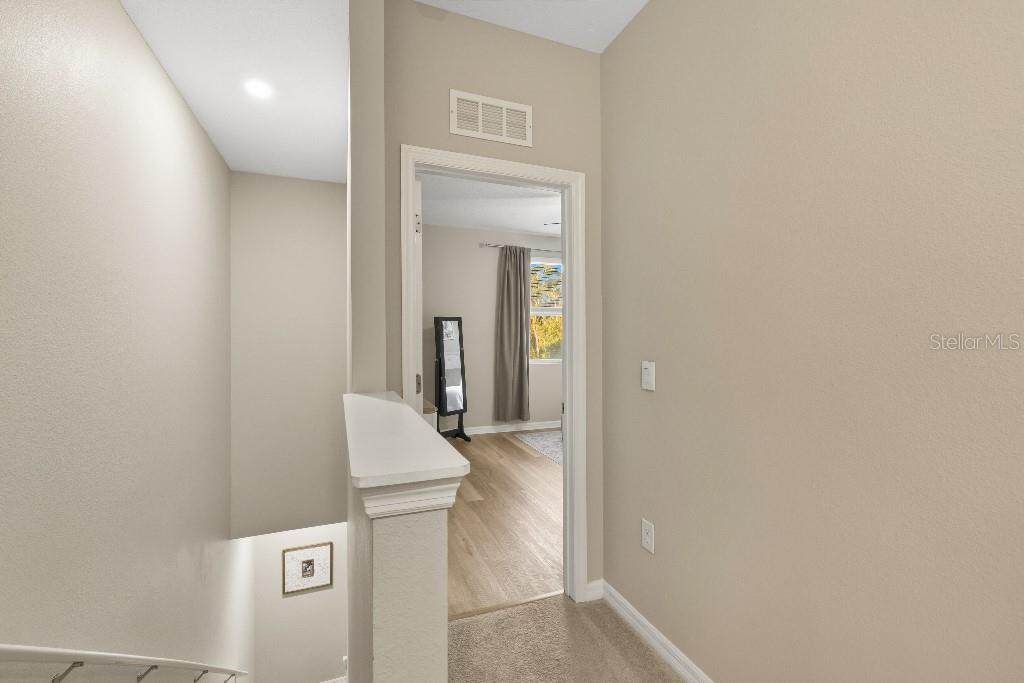 13664 Northwest 9th Road Newberry, FL 32669 - Photo 11 of 33 hallway with washer and dryer