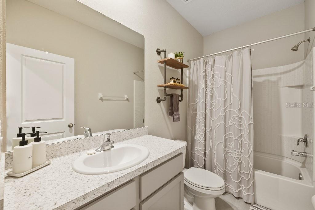 13664 Northwest 9th Road Newberry, FL 32669 - Photo 19 of 33 a bathroom with a sink toilet and shower