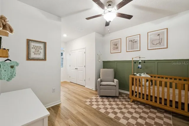 a bedroom with furniture and a rug