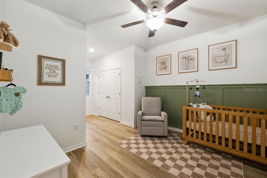 13664 Northwest 9th Road Newberry, FL 32669 - Photo 22 of 33 a bedroom with furniture and a rug