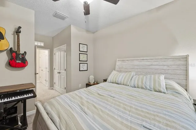 a bedroom with a bed and a dresser