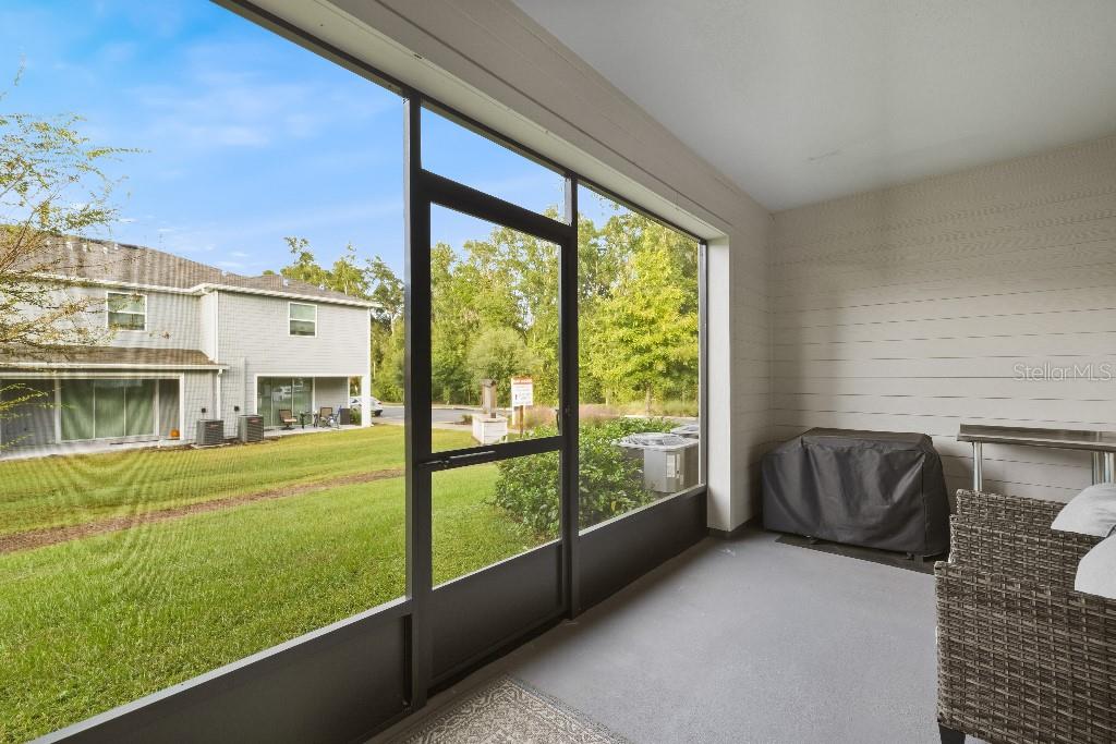 13664 Northwest 9th Road Newberry, FL 32669 - Photo 30 of 33 a living room with a bed furniture and garden view
