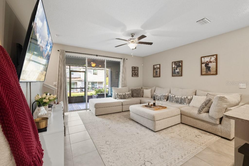 13664 Northwest 9th Road Newberry, FL 32669 - Photo 5 of 33 a living room with furniture potted plant and a large window