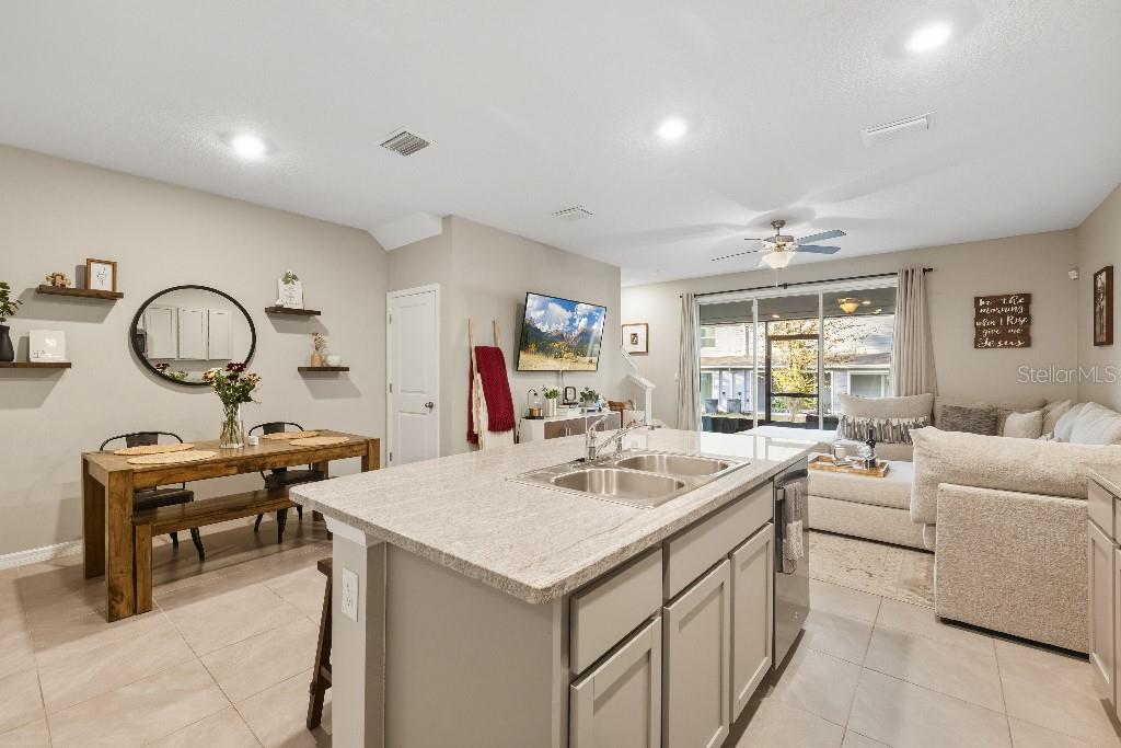 13664 Northwest 9th Road Newberry, FL 32669 - Photo 6 of 33 a view of a kitchen area with furniture and a window