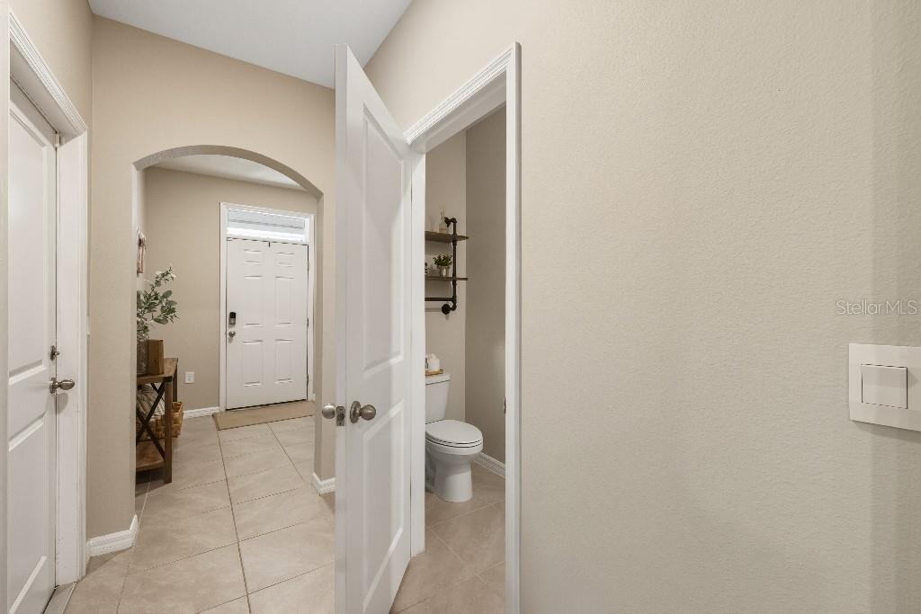 13664 Northwest 9th Road Newberry, FL 32669 - Photo 8 of 33 a view of a bathroom from a hallway
