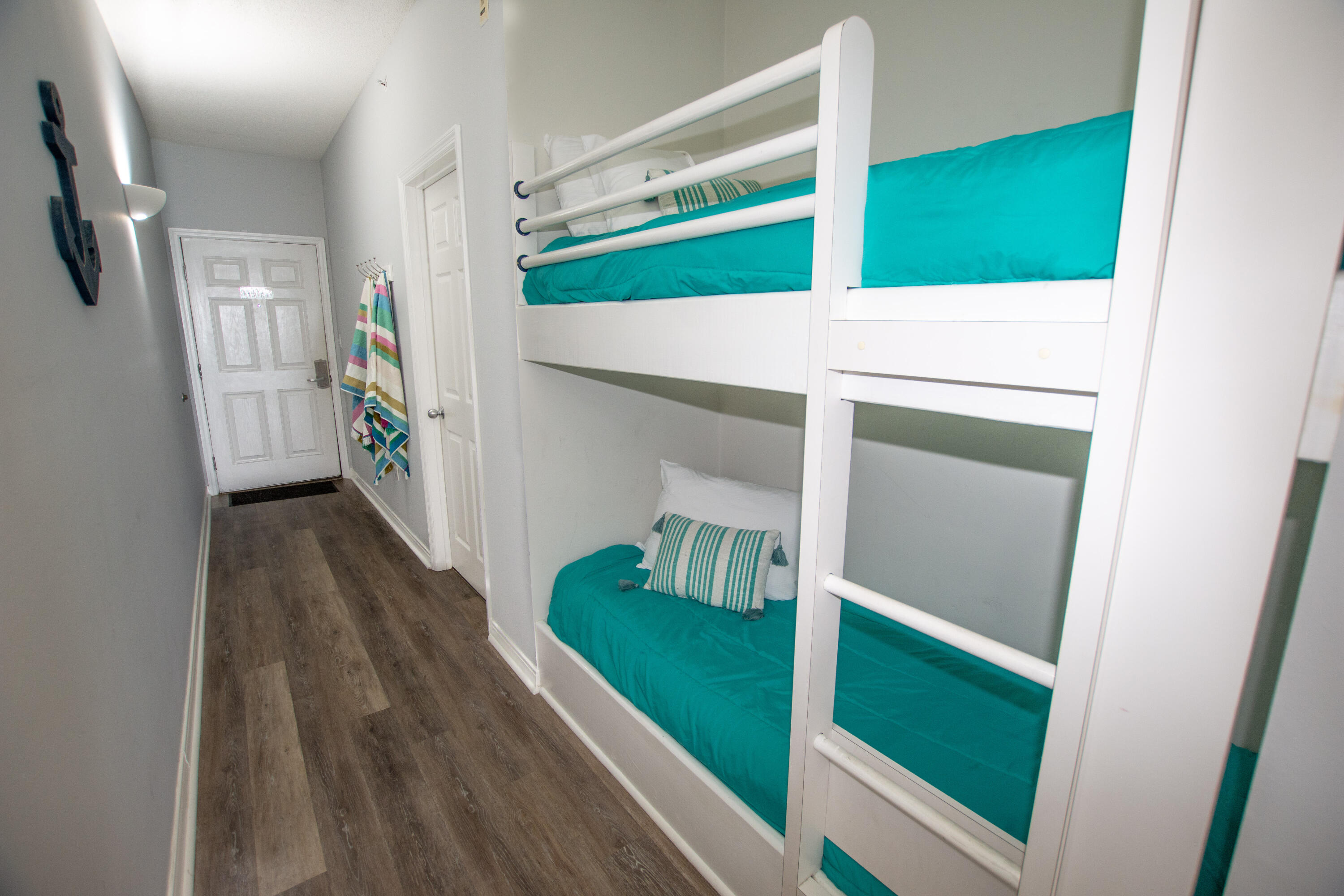 376 Santa Rosa Boulevard, Unit 507 Fort Walton Beach, FL 32548 - Photo 21 of 32 a hallway with wooden floor windows and entryway
