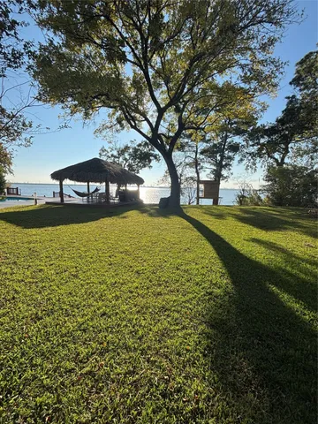 a view of a swimming pool with an outdoor space and seating area