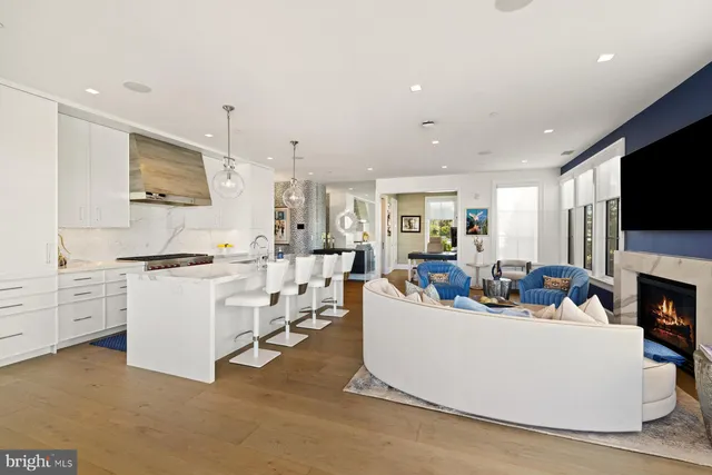 a living room with fireplace furniture and a flat screen tv