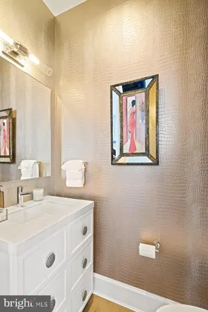 a bathroom with a sink a vanity and a mirror