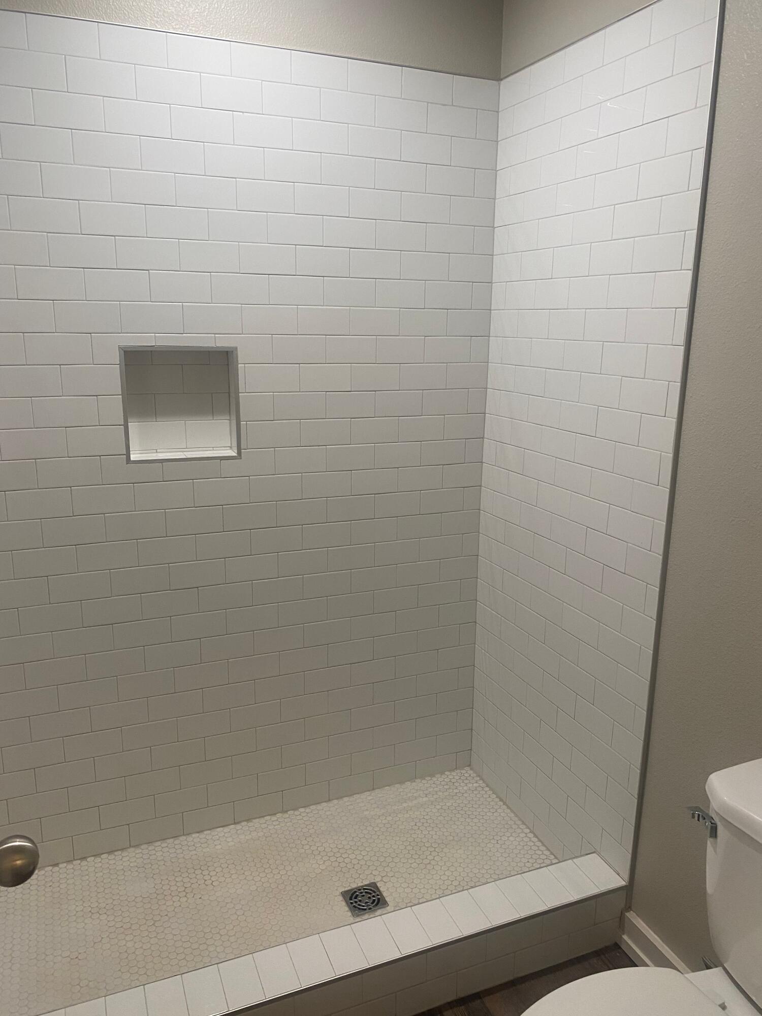 1609 Avenue O, Unit B Shallowater, TX 79363 - Photo 6 of 12 a bathroom with a shower