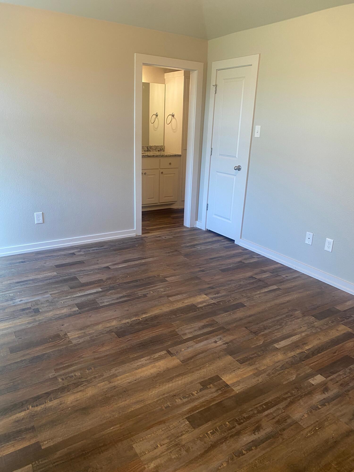 1609 Avenue O, Unit B Shallowater, TX 79363 - Photo 7 of 12 a view of a livingroom with wooden floor