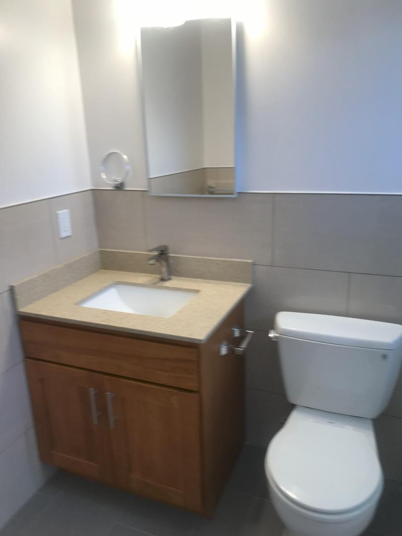 2469 Olive Avenue San Jose, CA 95128 - Photo 2 of 10 a bathroom with a toilet sink and mirror