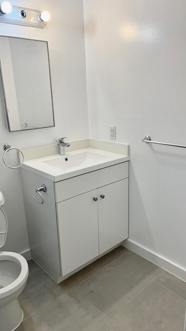 2469 Olive Avenue San Jose, CA 95128 - Photo 8 of 10 a bathroom with a sink toilet and mirror
