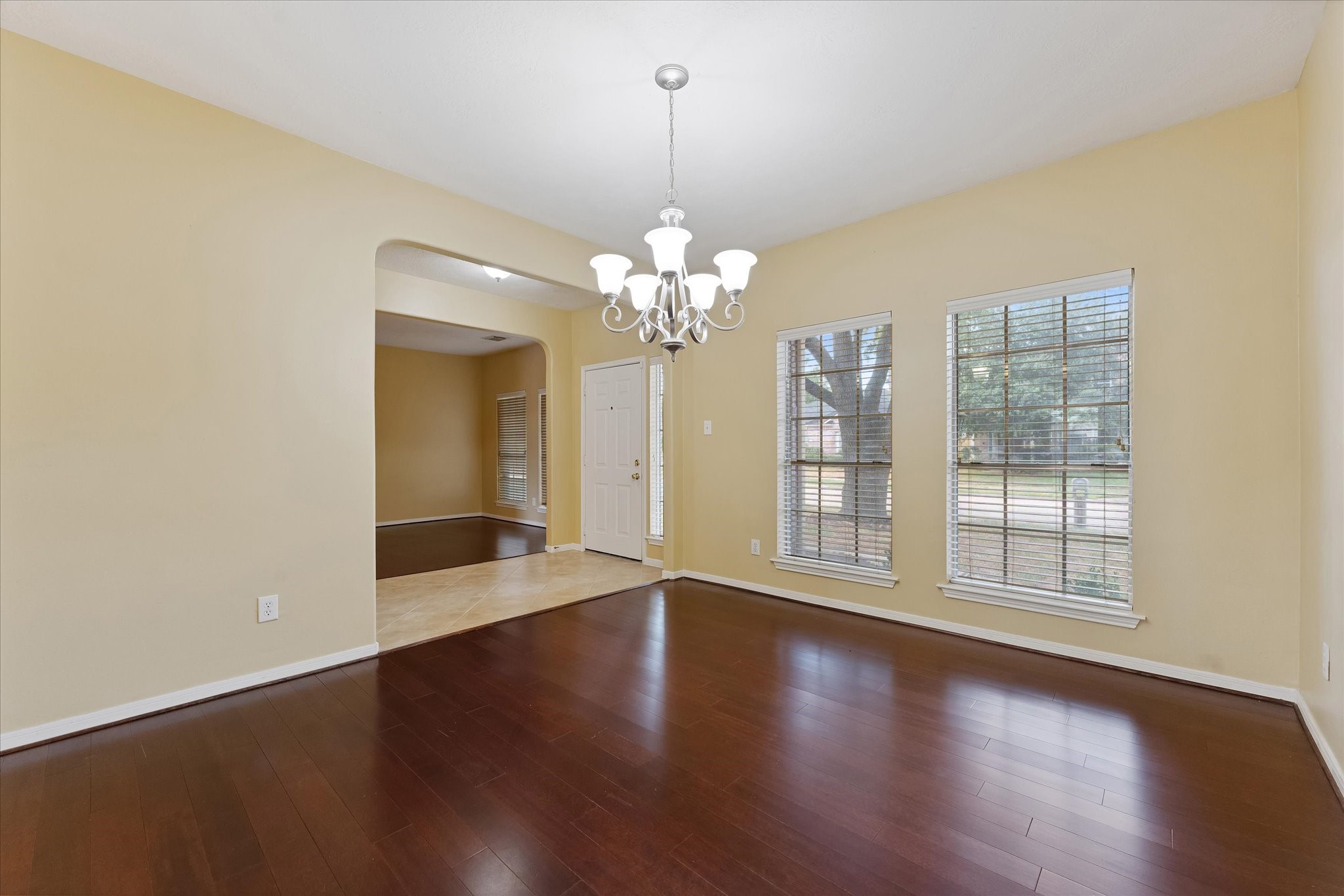 23806 Spring Way Drive Spring, TX 77373 - Photo 12 of 44 a view of an empty room with wooden floor and a window