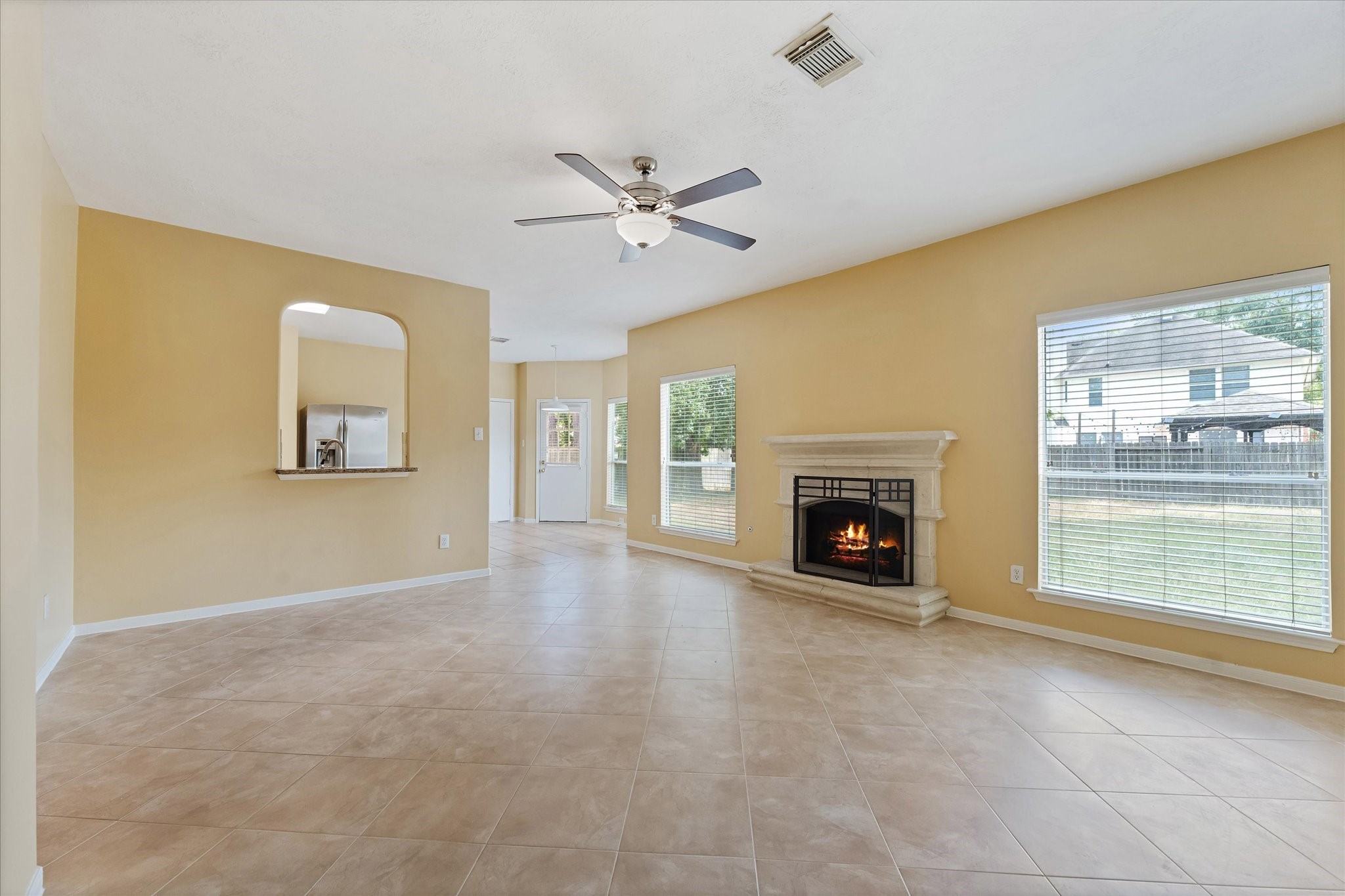 23806 Spring Way Drive Spring, TX 77373 - Photo 20 of 44 an empty room with windows and fireplace