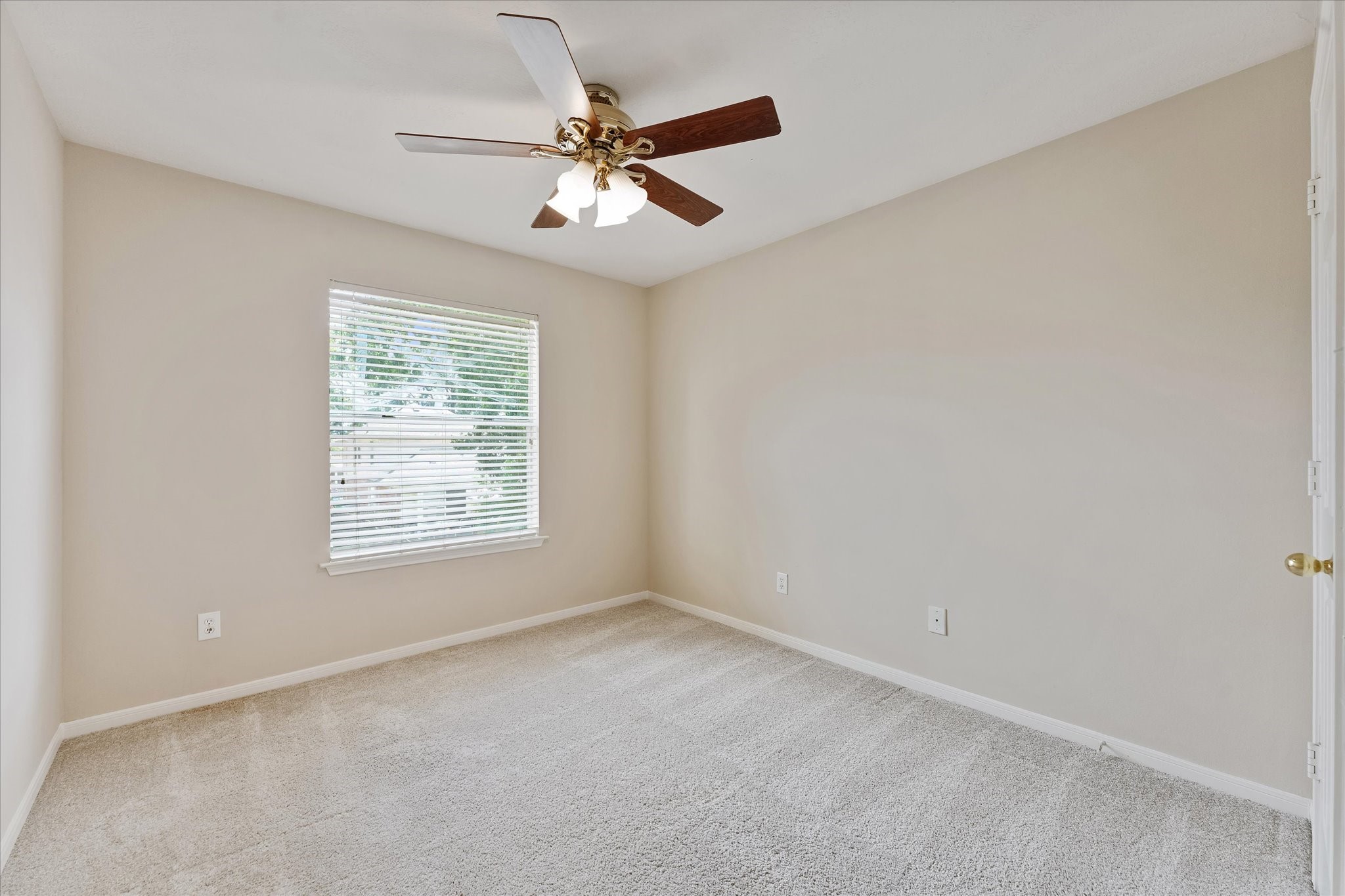 23806 Spring Way Drive Spring, TX 77373 - Photo 25 of 44 an empty room with a window and a fan