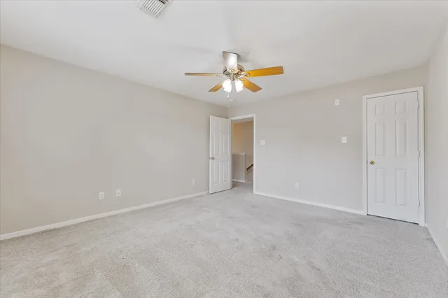 a view of an empty walk in closet