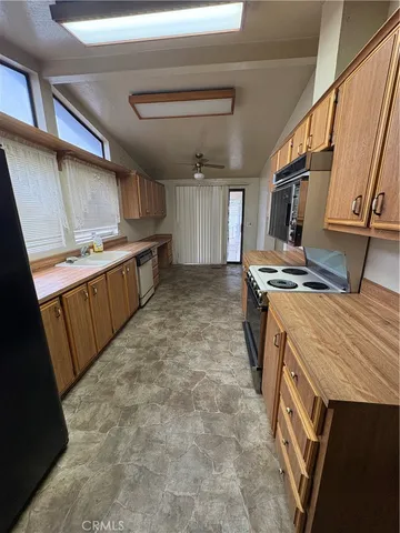 a kitchen with sink cabinets and stove