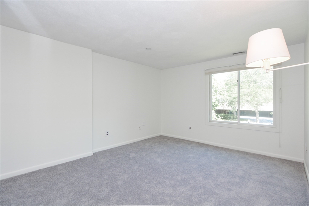 8 Concord Greene, Unit 4 Concord, MA 01742 - Photo 14 of 42 an empty room with a window
