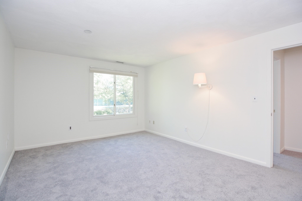8 Concord Greene, Unit 4 Concord, MA 01742 - Photo 16 of 42 an empty room with a window