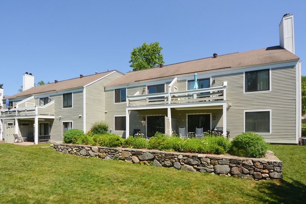8 Concord Greene, Unit 4 Concord, MA 01742 - Photo 26 of 42 a front view of a house with a yard
