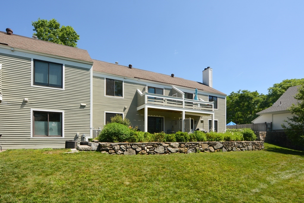 8 Concord Greene, Unit 4 Concord, MA 01742 - Photo 28 of 42 a front view of house with yard and green space