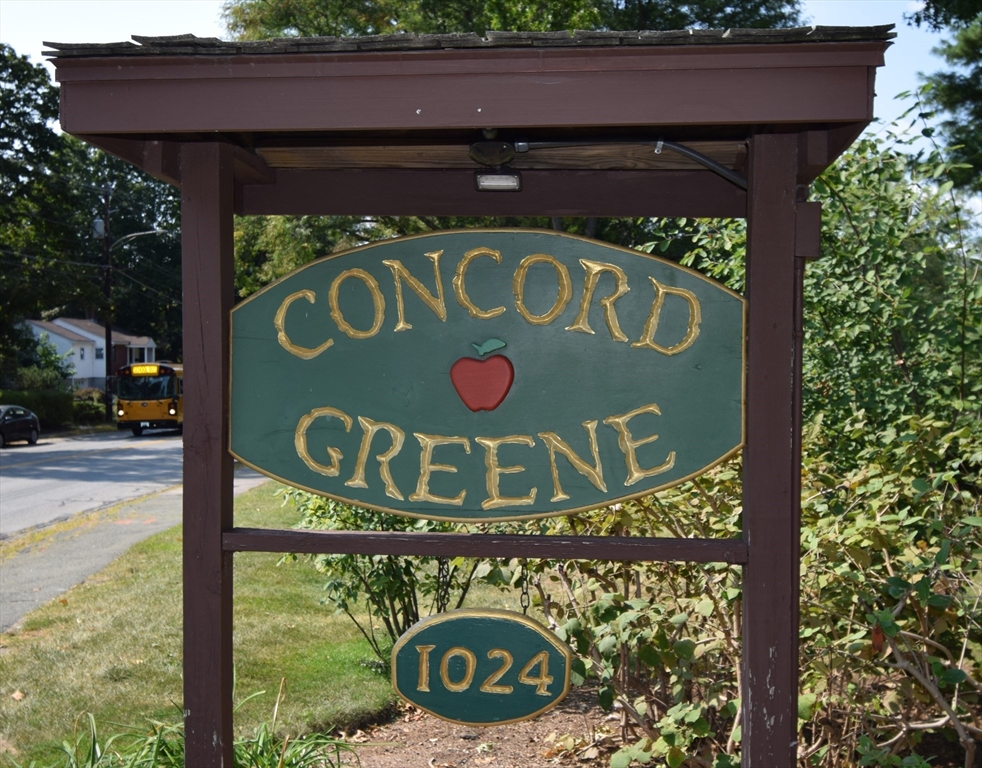 8 Concord Greene, Unit 4 Concord, MA 01742 - Photo 29 of 42 a sign that is on the side of a building