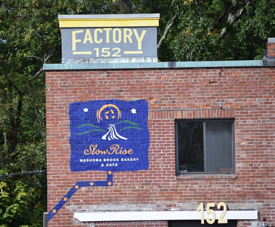 8 Concord Greene, Unit 4 Concord, MA 01742 - Photo 42 of 42 a sign that is on the wall of building