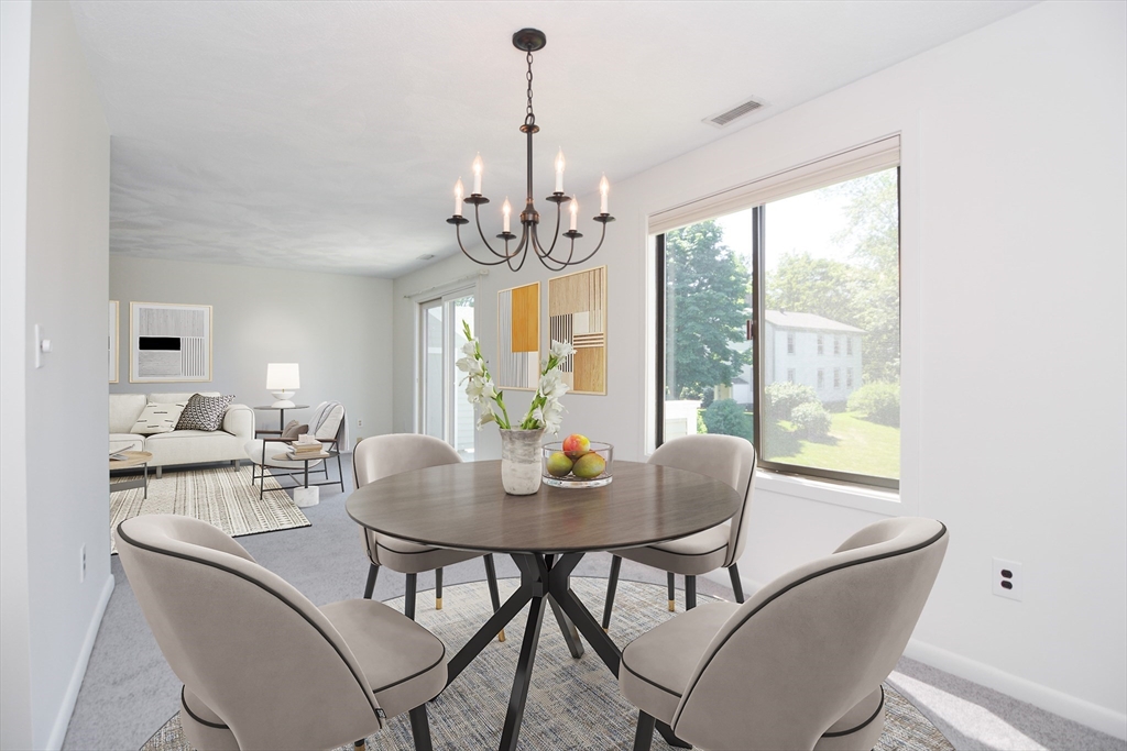 8 Concord Greene, Unit 4 Concord, MA 01742 - Photo 6 of 42 a view of a dining room with furniture window and outside view