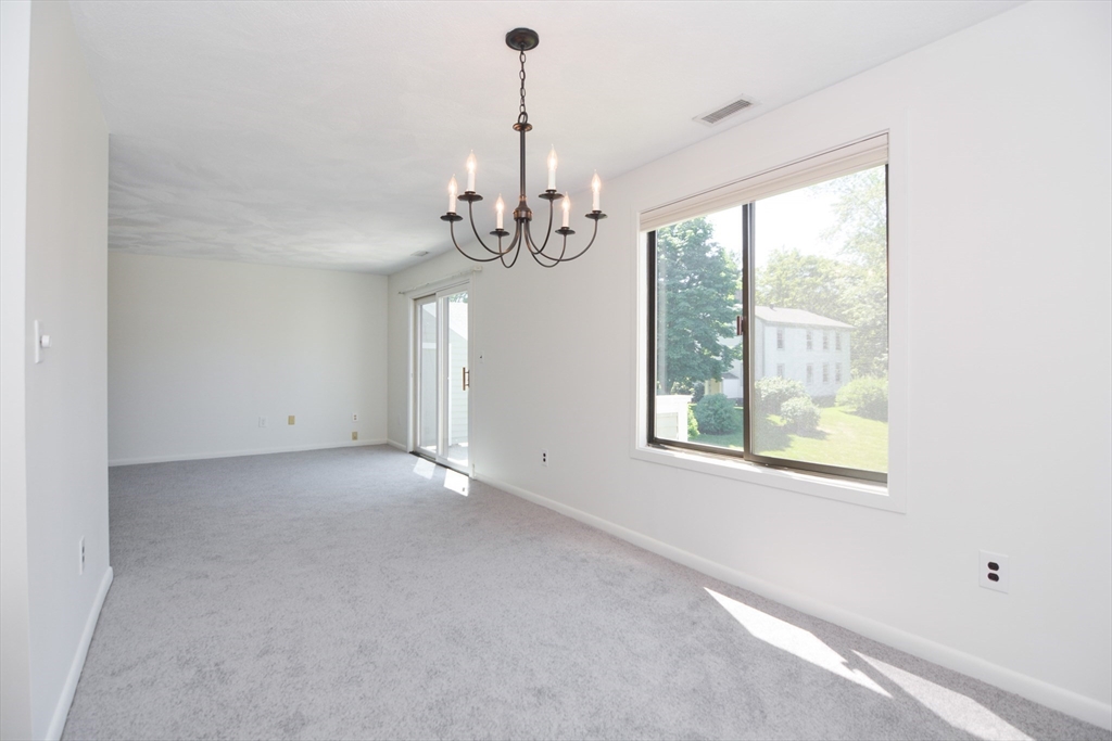 8 Concord Greene, Unit 4 Concord, MA 01742 - Photo 7 of 42 a view of an empty room with a window