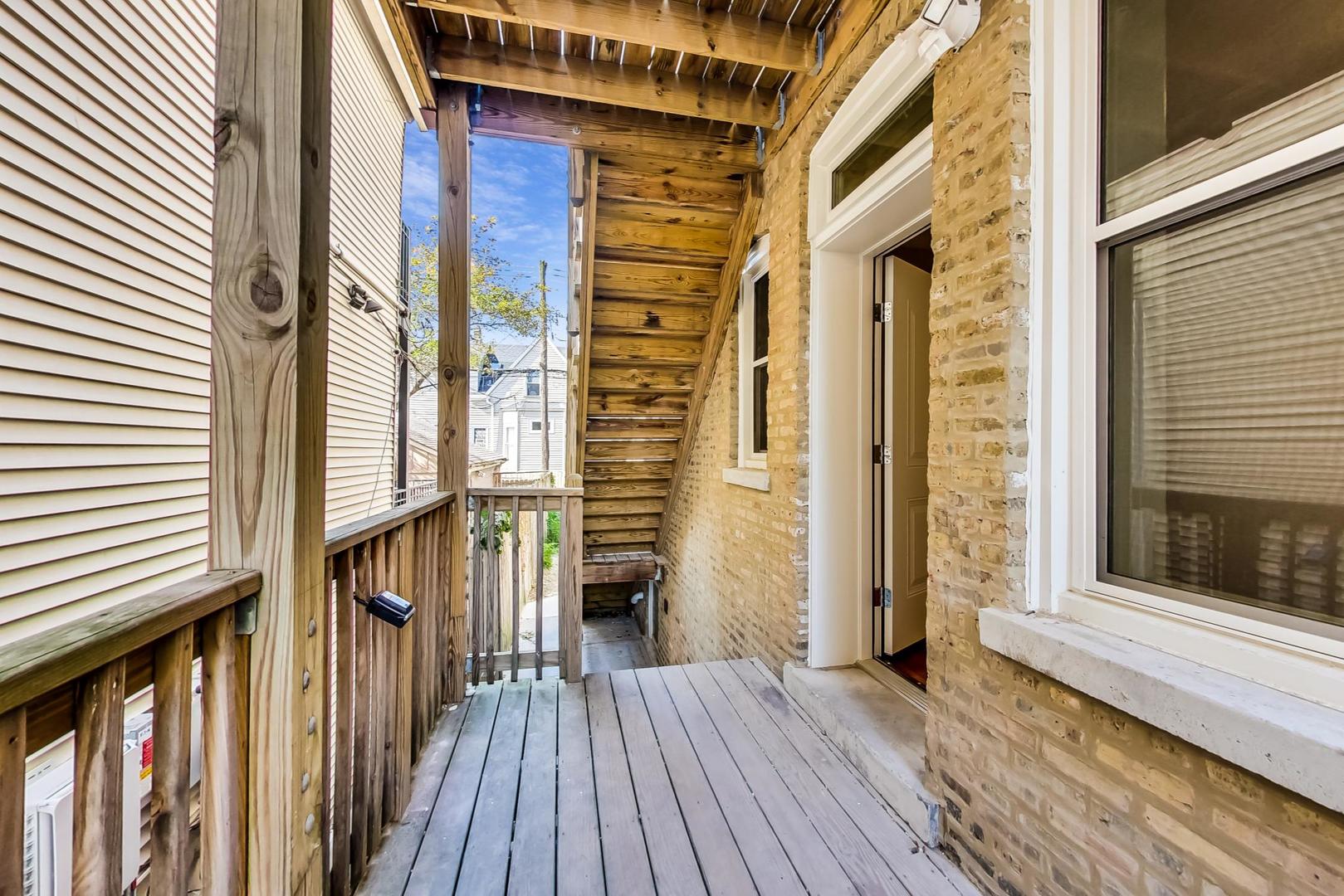 3534 West Wrightwood Avenue, Unit 1F Chicago, IL 60647 - Photo 16 of 18 a view of a house with wooden floor and a window