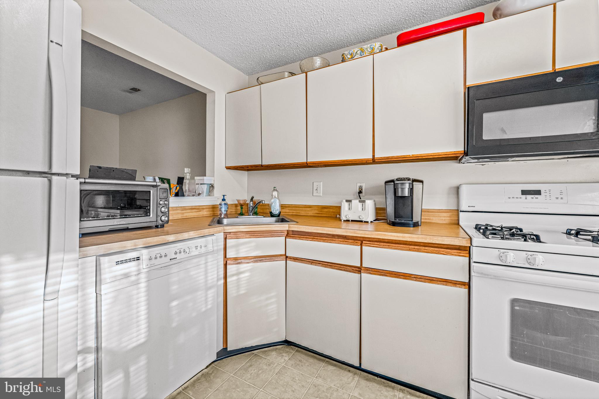 656 Covington Court Sewell, NJ 08080 - Photo 15 of 26 a kitchen with cabinets stainless steel appliances and sink