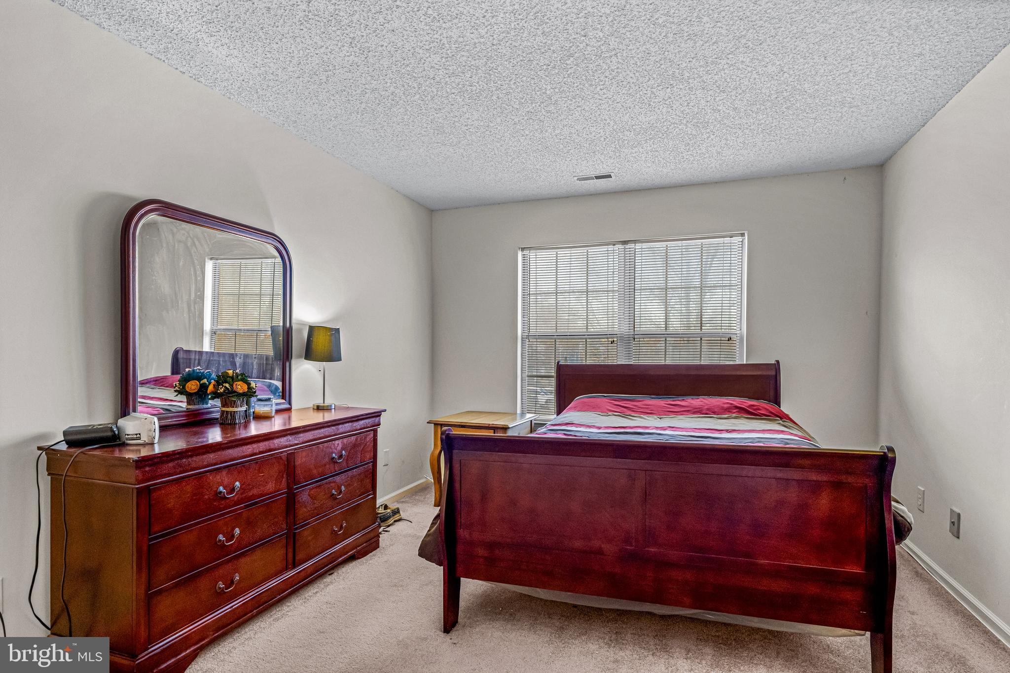 656 Covington Court Sewell, NJ 08080 - Photo 20 of 26 a bedroom with a bed and a dresser