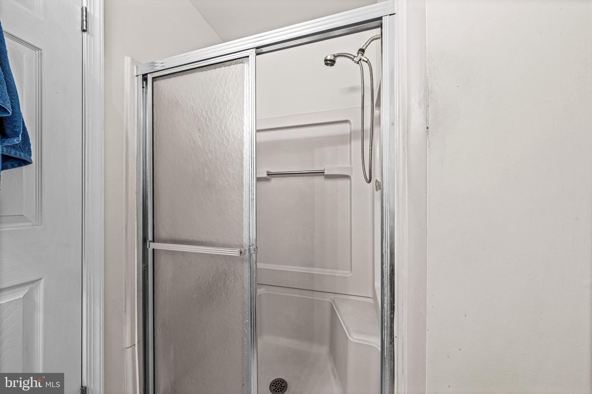 656 Covington Court Sewell, NJ 08080 - Photo 23 of 26 a bathroom with a glass shower door