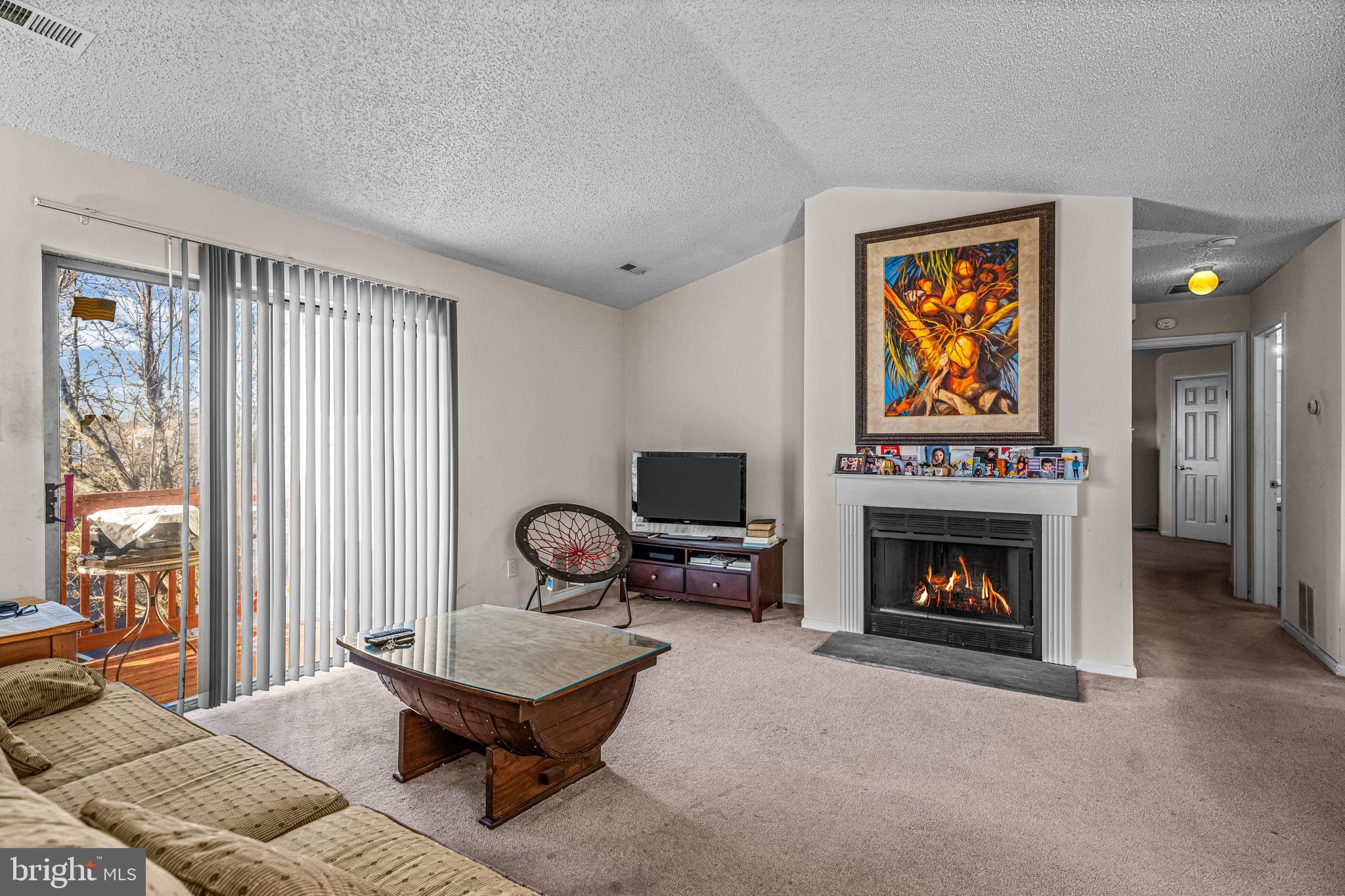 656 Covington Court Sewell, NJ 08080 - Photo 10 of 26 a living room with furniture and a fireplace