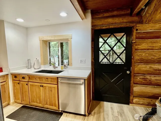 a kitchen with a sink and cabinets