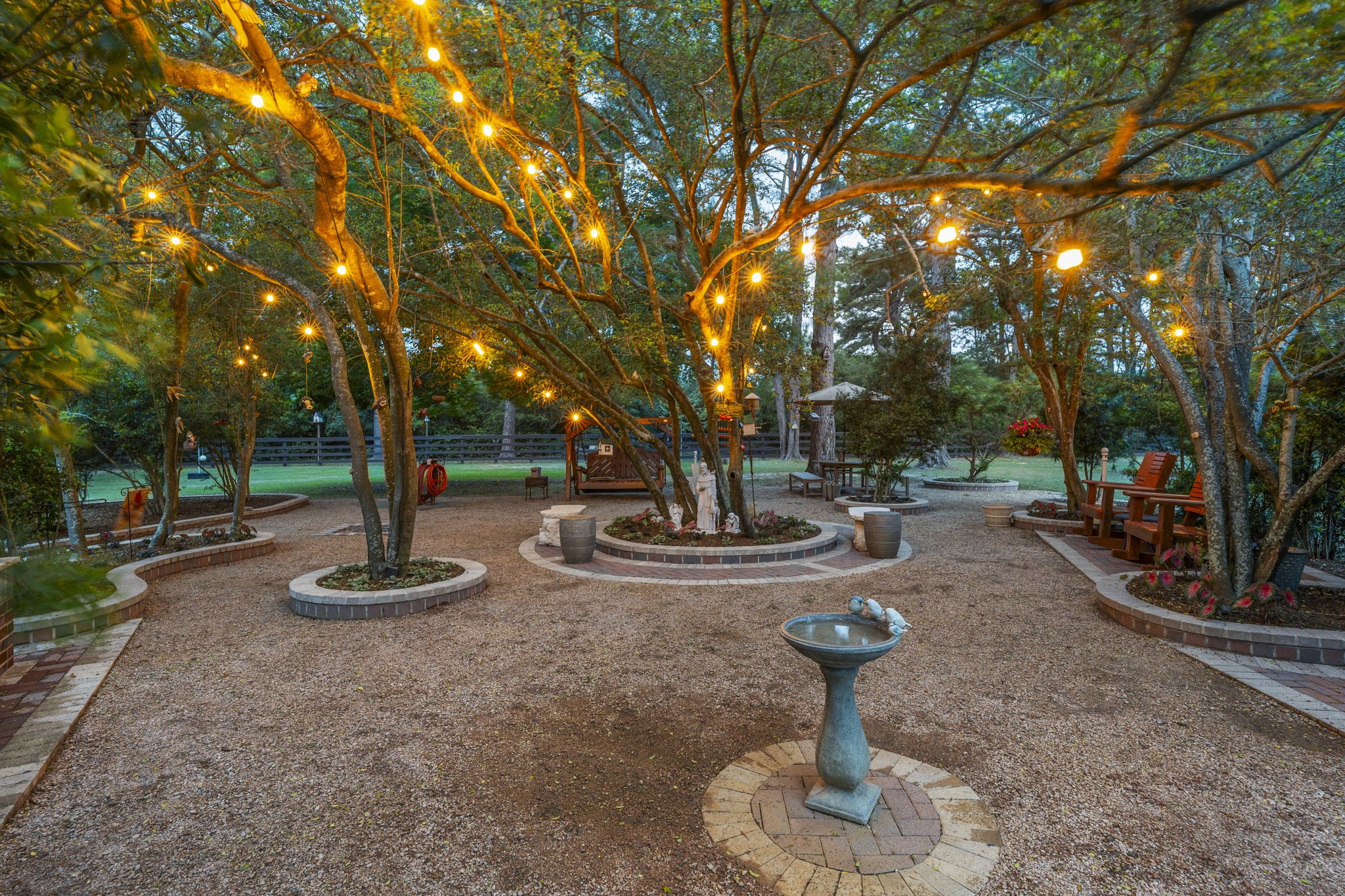 5 Willowcreek Ranch Road Tomball, TX 77377 - Photo 42 of 50 Thoughtfully lit meditation garden for evening calm