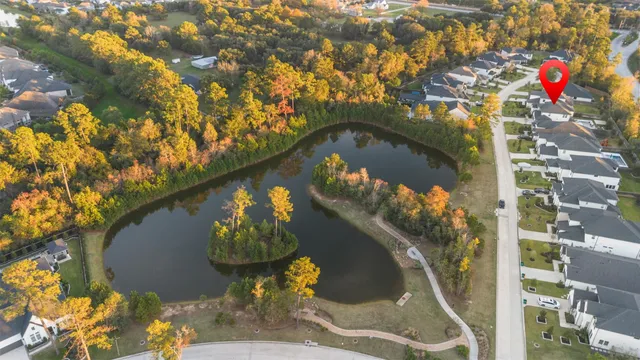 a blue swimming pool with a trees in the background