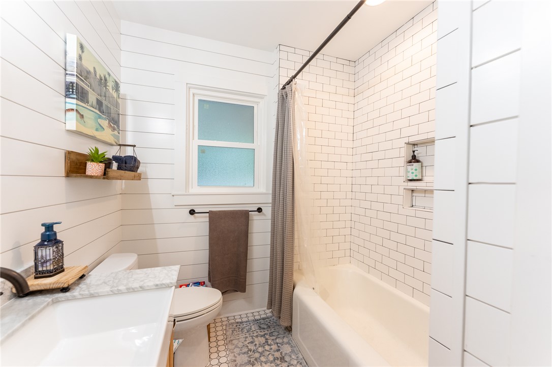 103 Riggs Drive Clemson, SC 29631 - Photo 30 of 50 A pristine bathroom featuring shiplap walls and classic subway tile surrounding the tub.