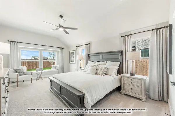 a bedroom with a large bed and a large window