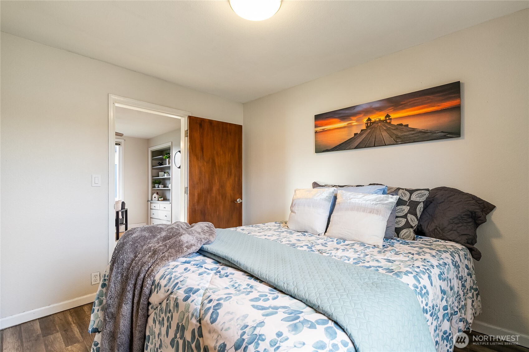 414 Edson Street Lynden, WA 98264 - Photo 13 of 32 a bedroom with a bed and a painting on the wall