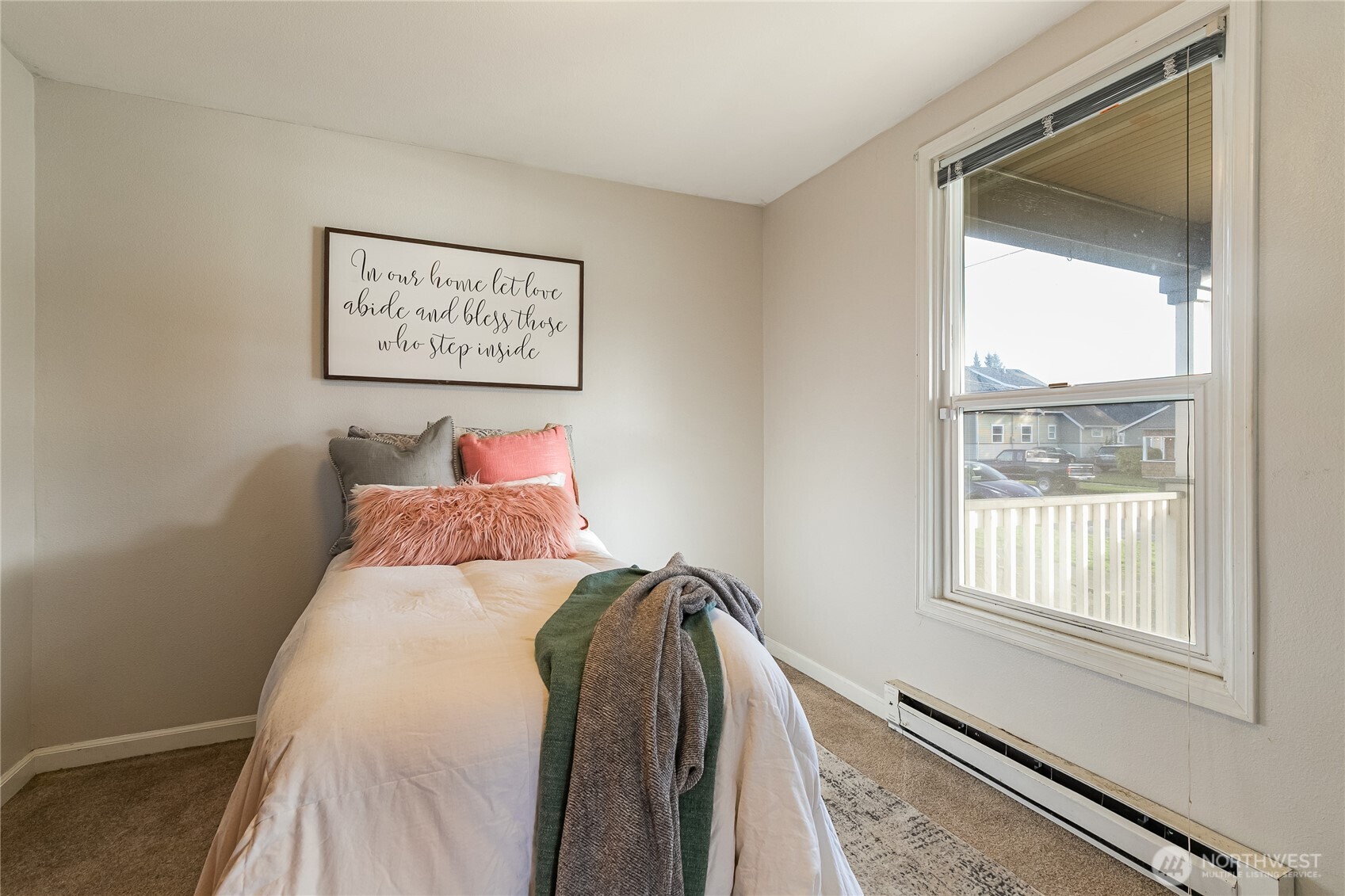 414 Edson Street Lynden, WA 98264 - Photo 15 of 32 a bed sitting in a bedroom next to a window