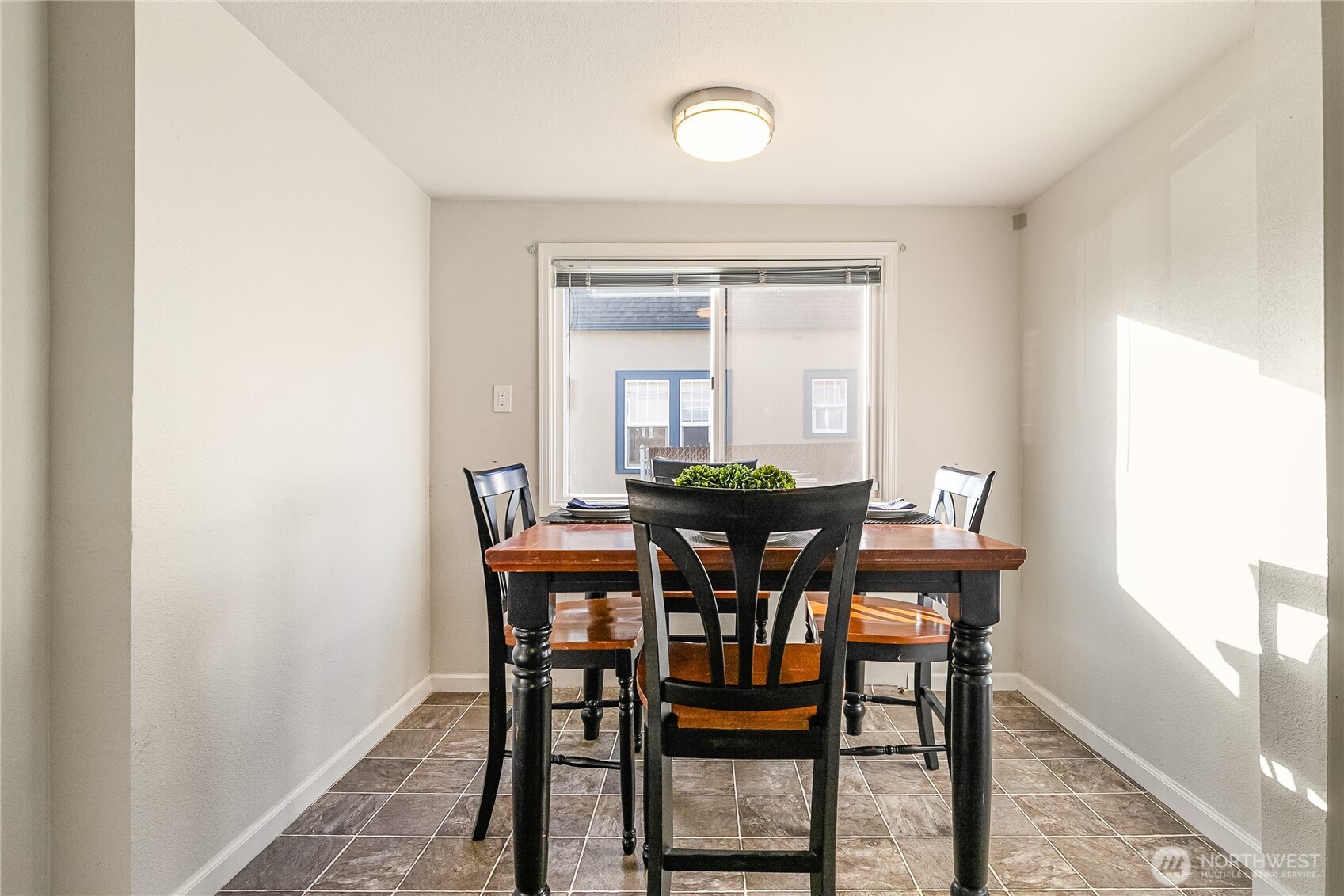 414 Edson Street Lynden, WA 98264 - Photo 17 of 32 a view of a dining room with furniture and window