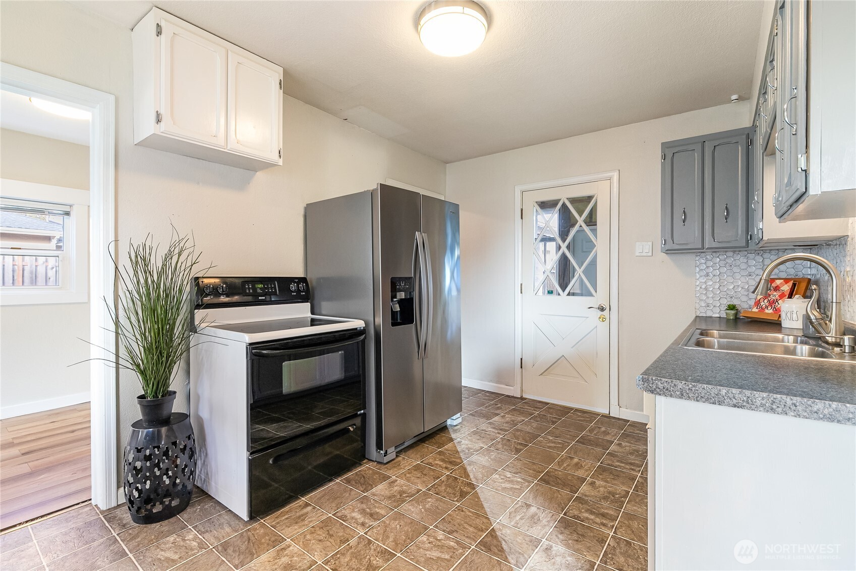 414 Edson Street Lynden, WA 98264 - Photo 23 of 32 a kitchen with stainless steel appliances granite countertop a refrigerator and a sink